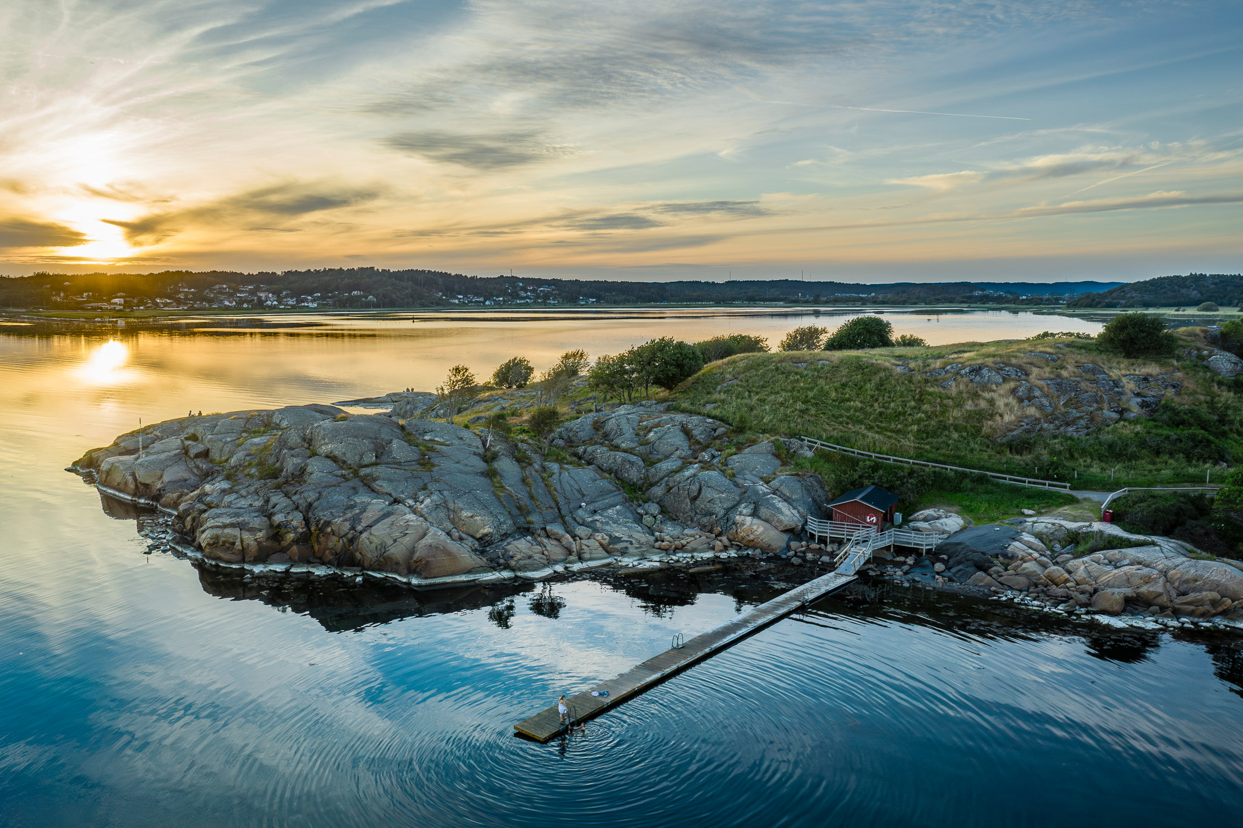 View over a jetty when the sun is setting Bohuslän