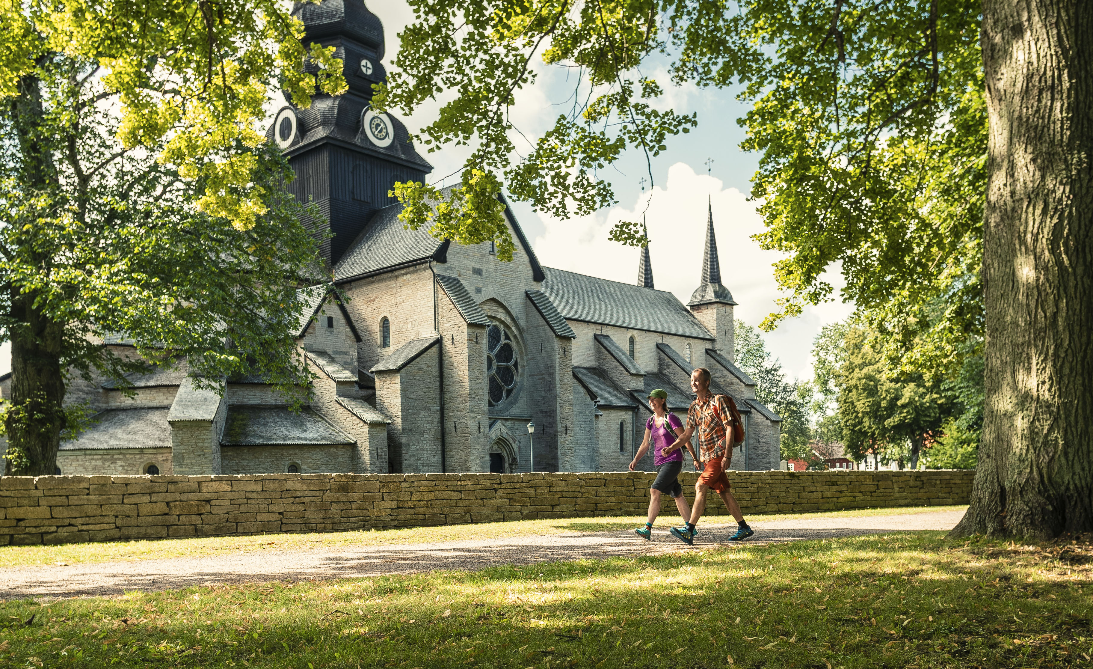 Pilgrim hikers in front of a church.