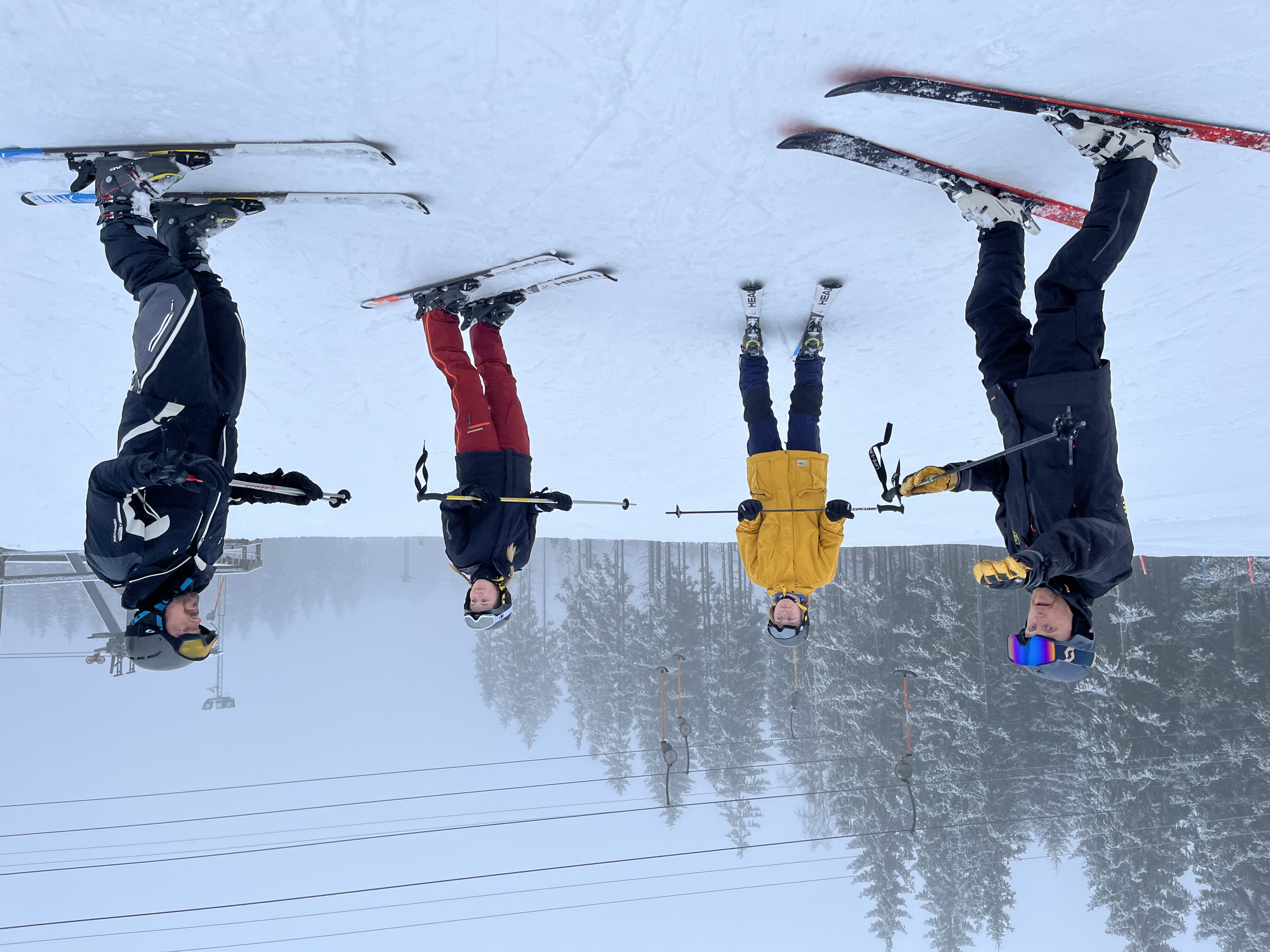 Ski instructor with students in the slalom slope.