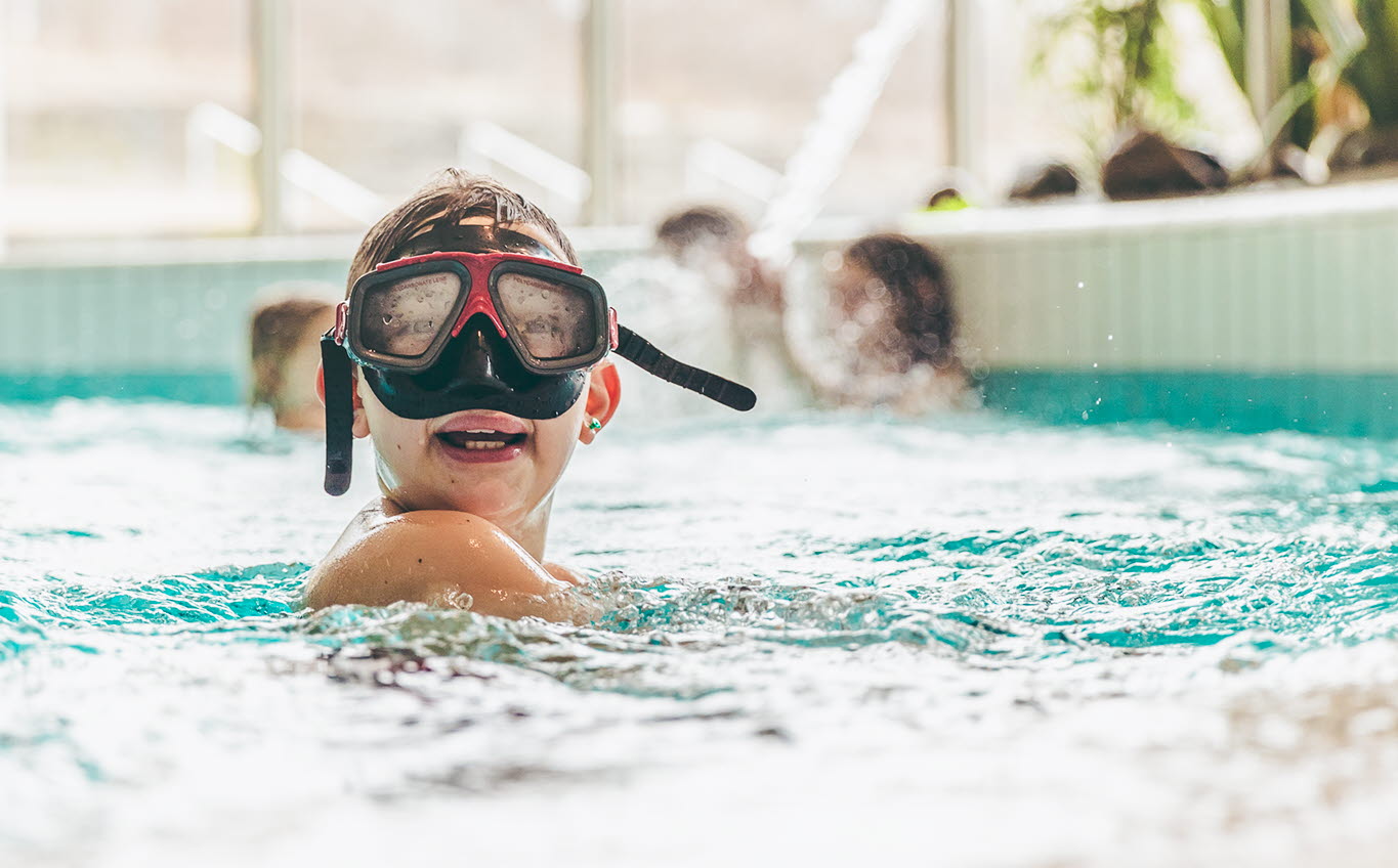 Boy with cyclop who is in the pool.