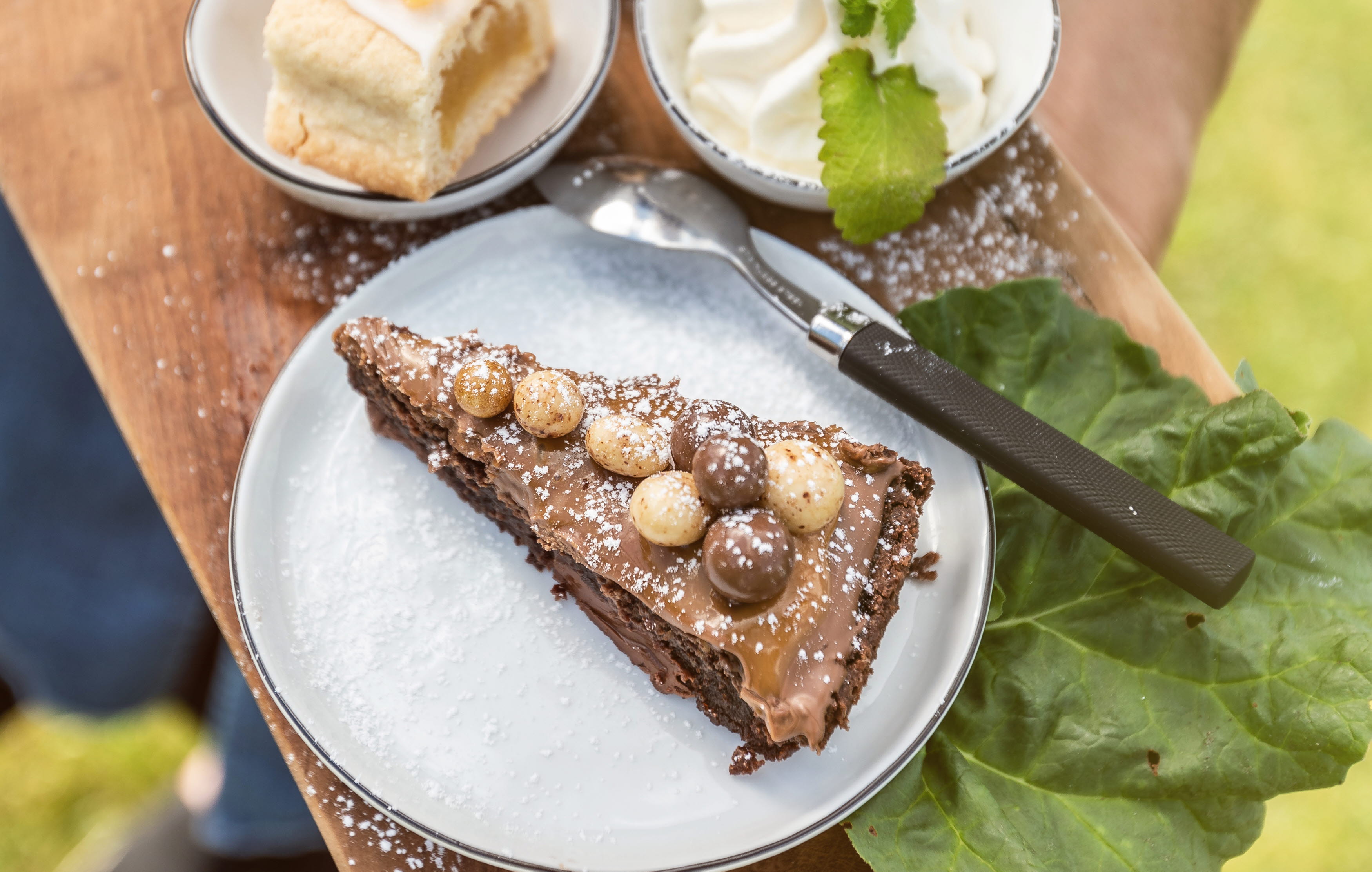 Draft cake, bun and a cake on a wooden board.