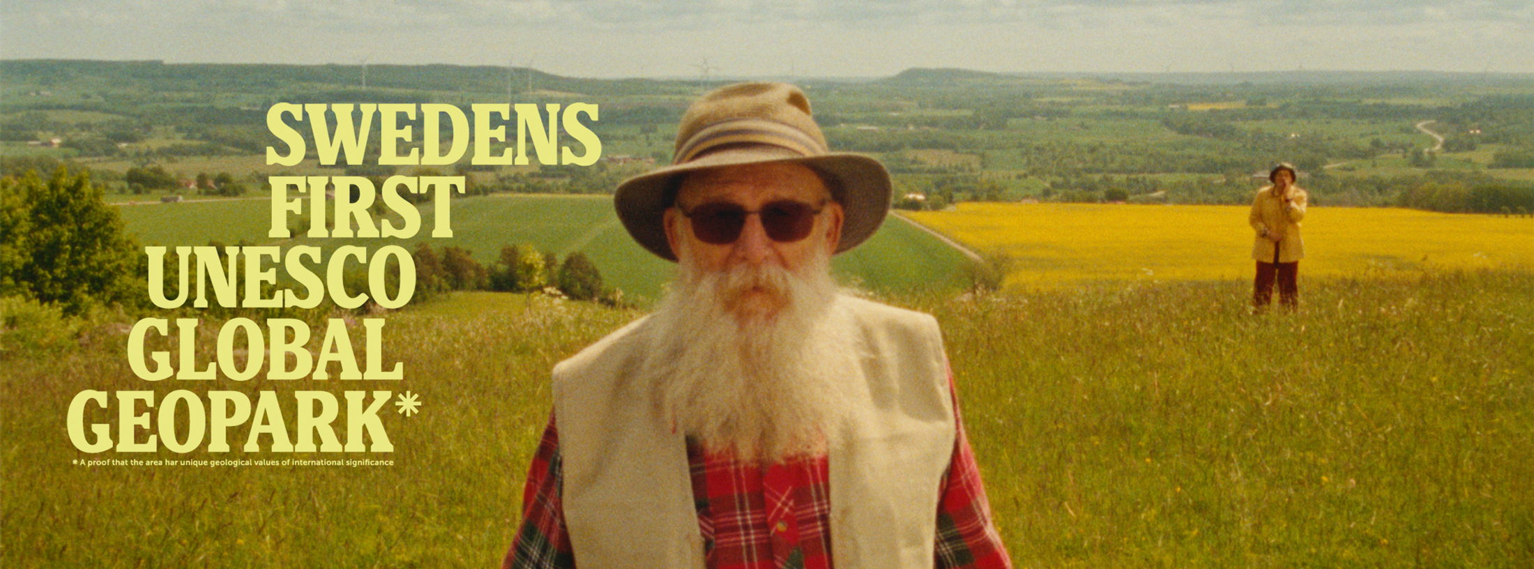 en man i vitt skägg och hatt. Texten Swedens first Unesco Global Geopark står på bilden.