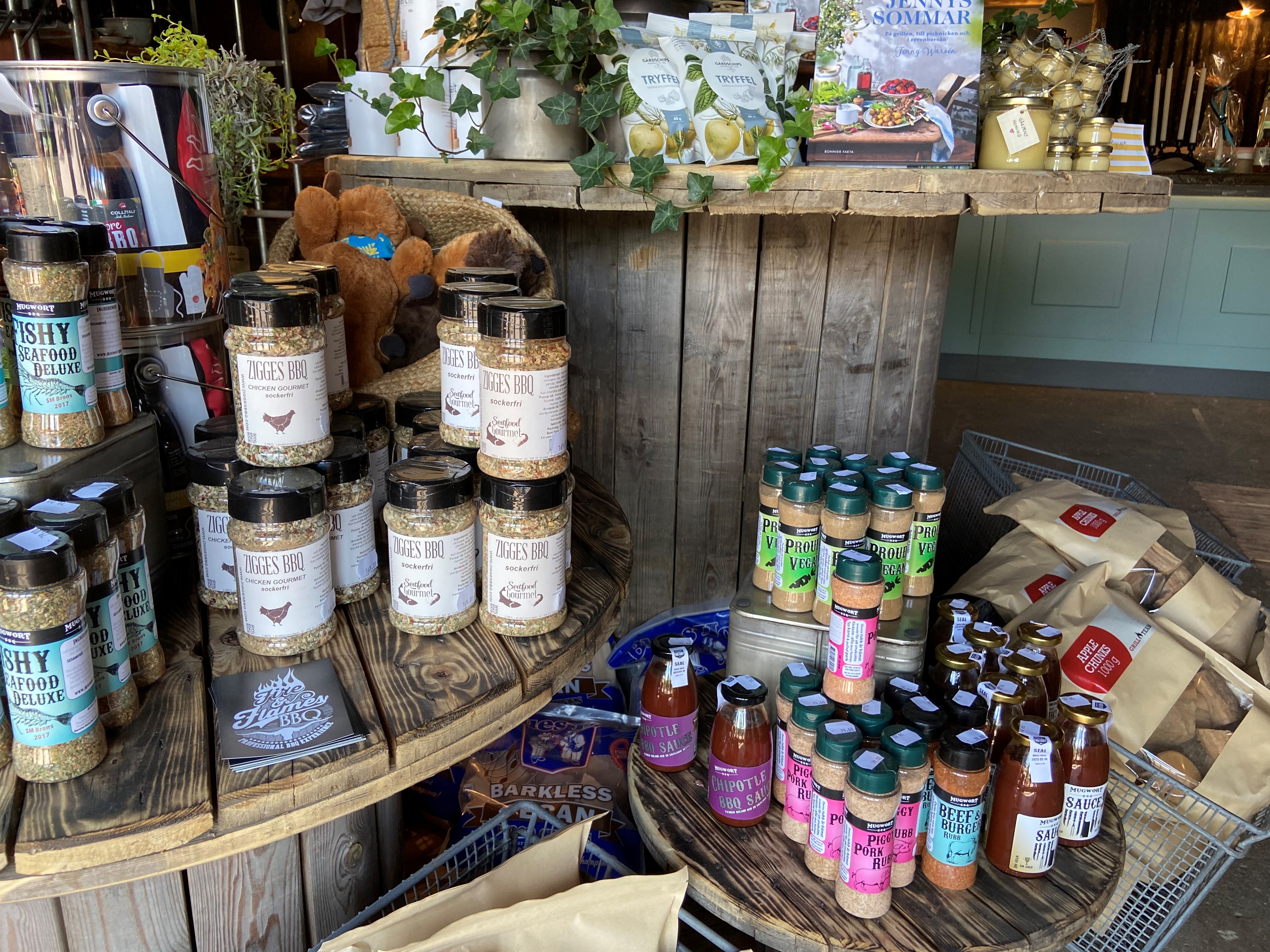 Spices standing on wooden shelves.