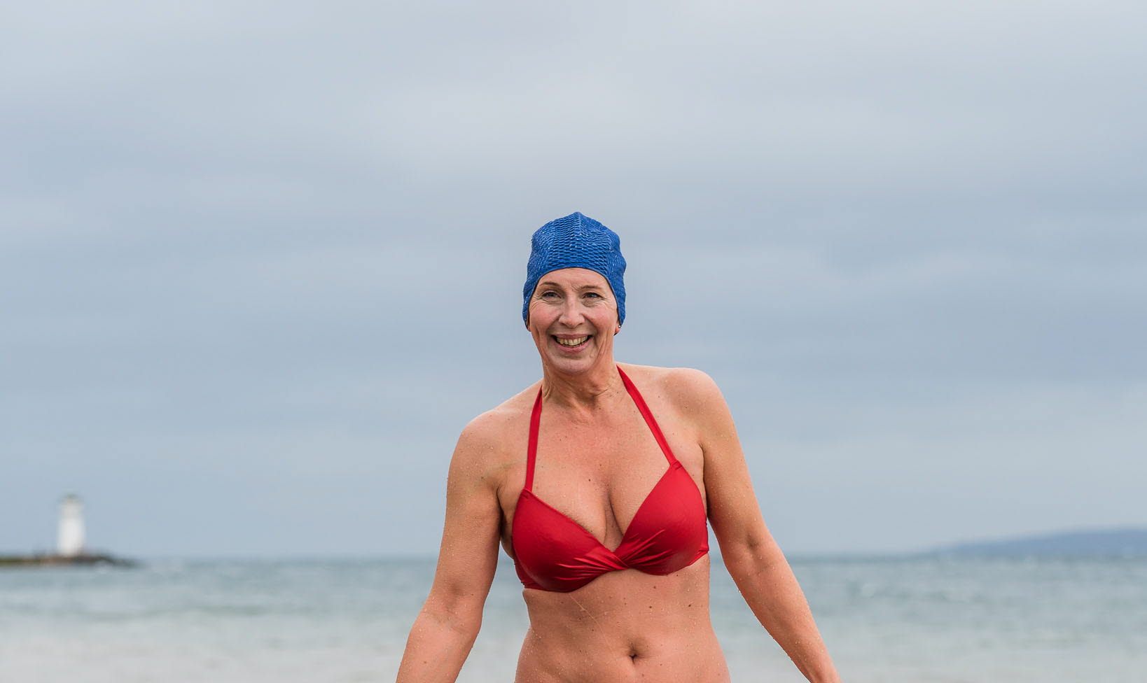 Woman winter bathing in lake Vättern, Hjo. 
