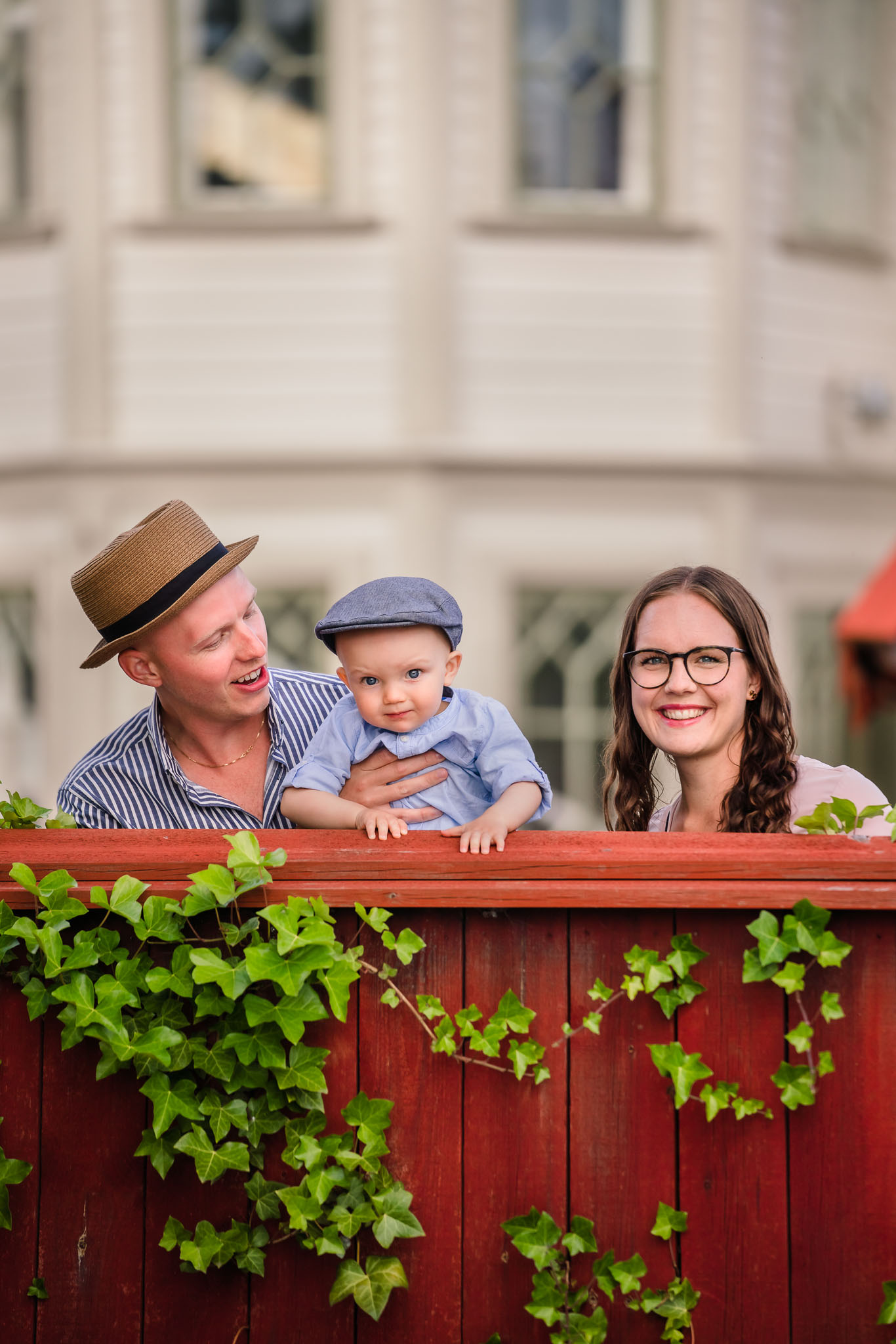 Family coming up behind a fence 