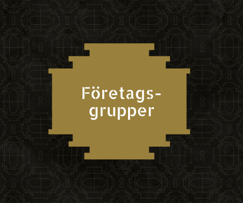 Bild med svart bakgrund och en guldfärgad platta med text ovanpå. Texten är "Företagsgrupper"