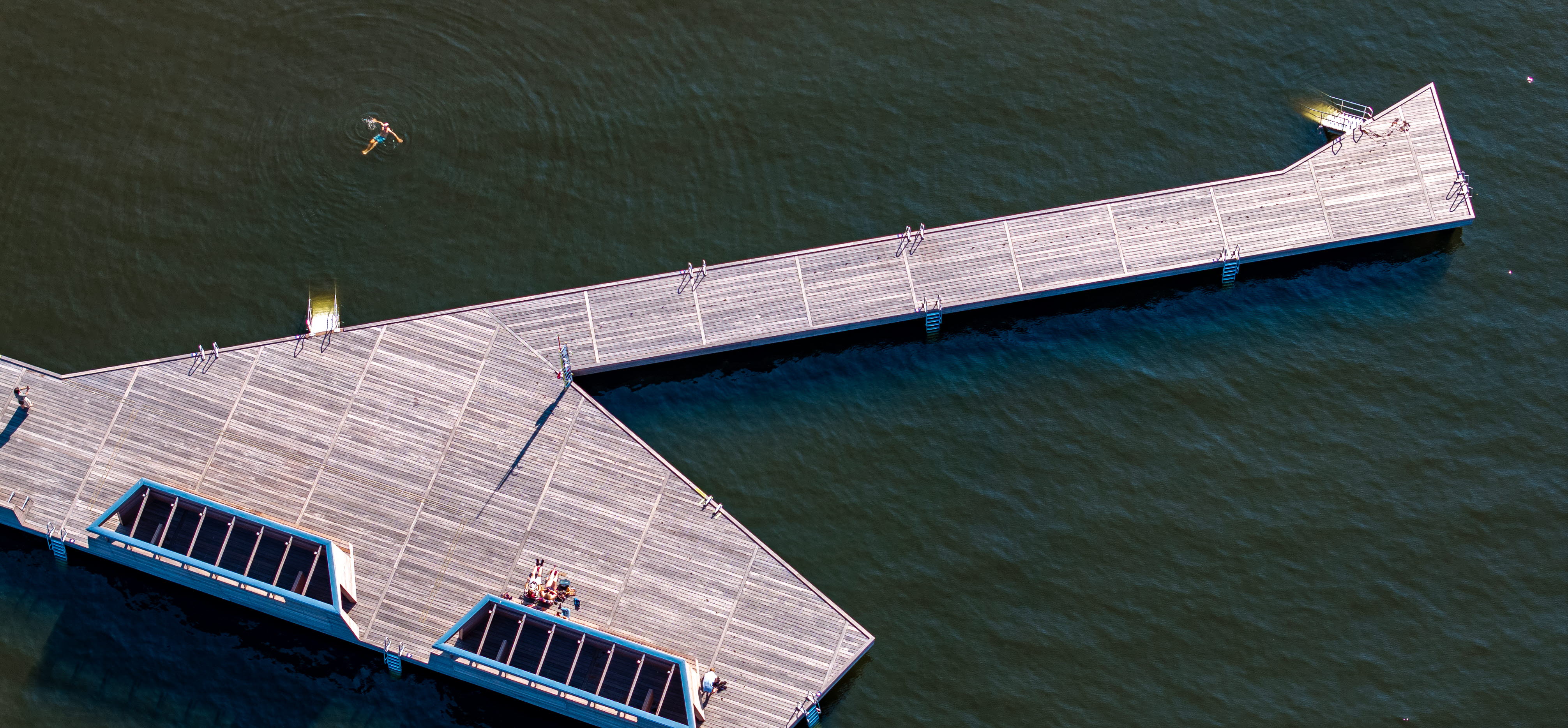 Framnäs Strandpark with a swimming jetty extending into the calm wate