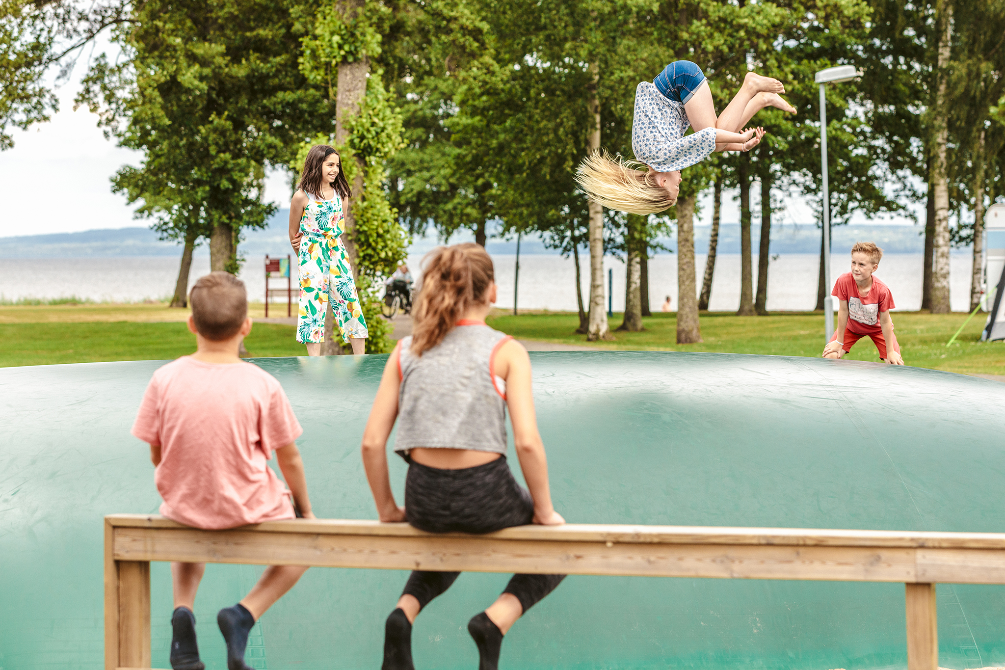 Child bouncing on a trampoline.