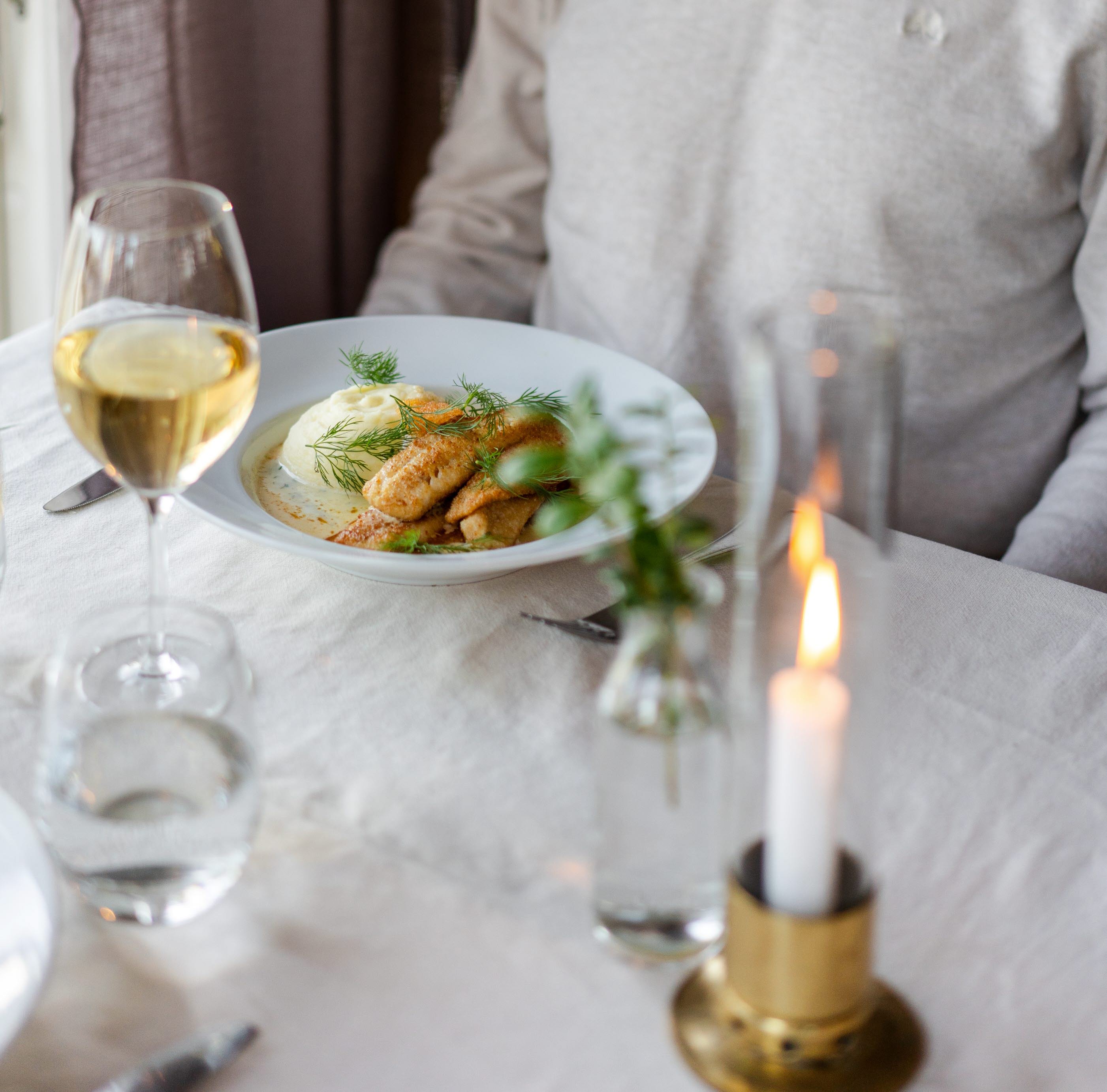 A man eating dinner at a restaurant.