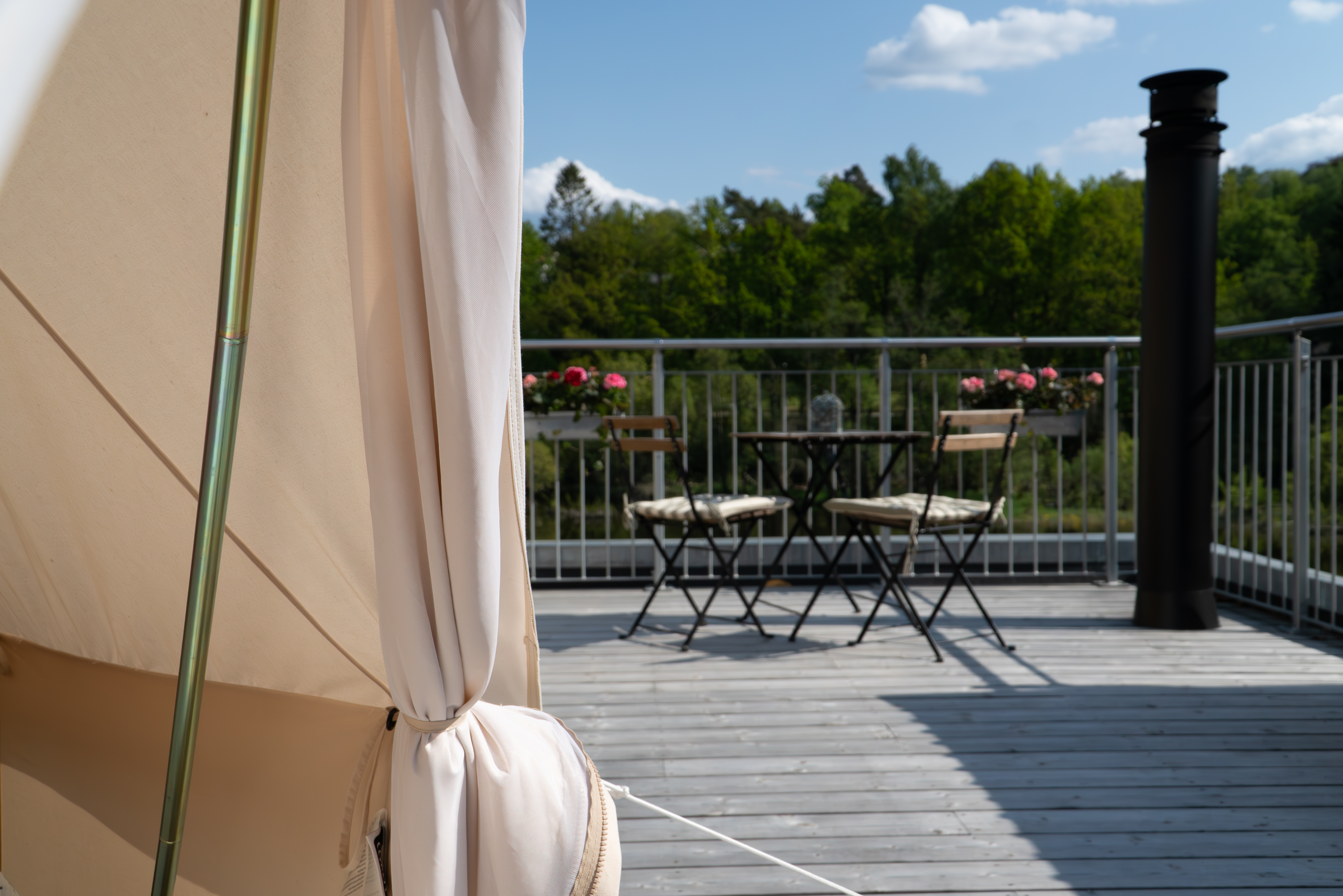 glamping tent on roof with view over lake