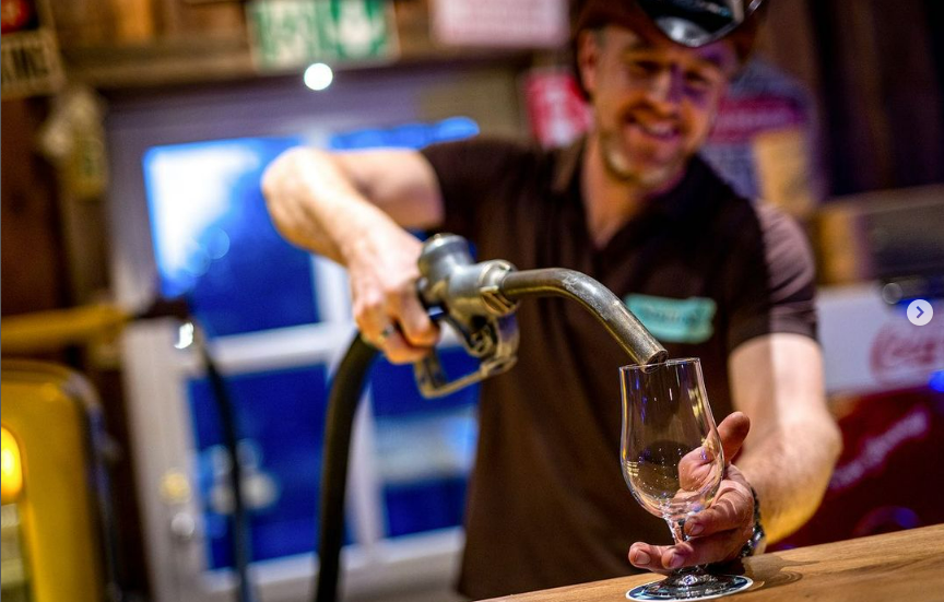 Nellies diner, pouring beer from gas pump
