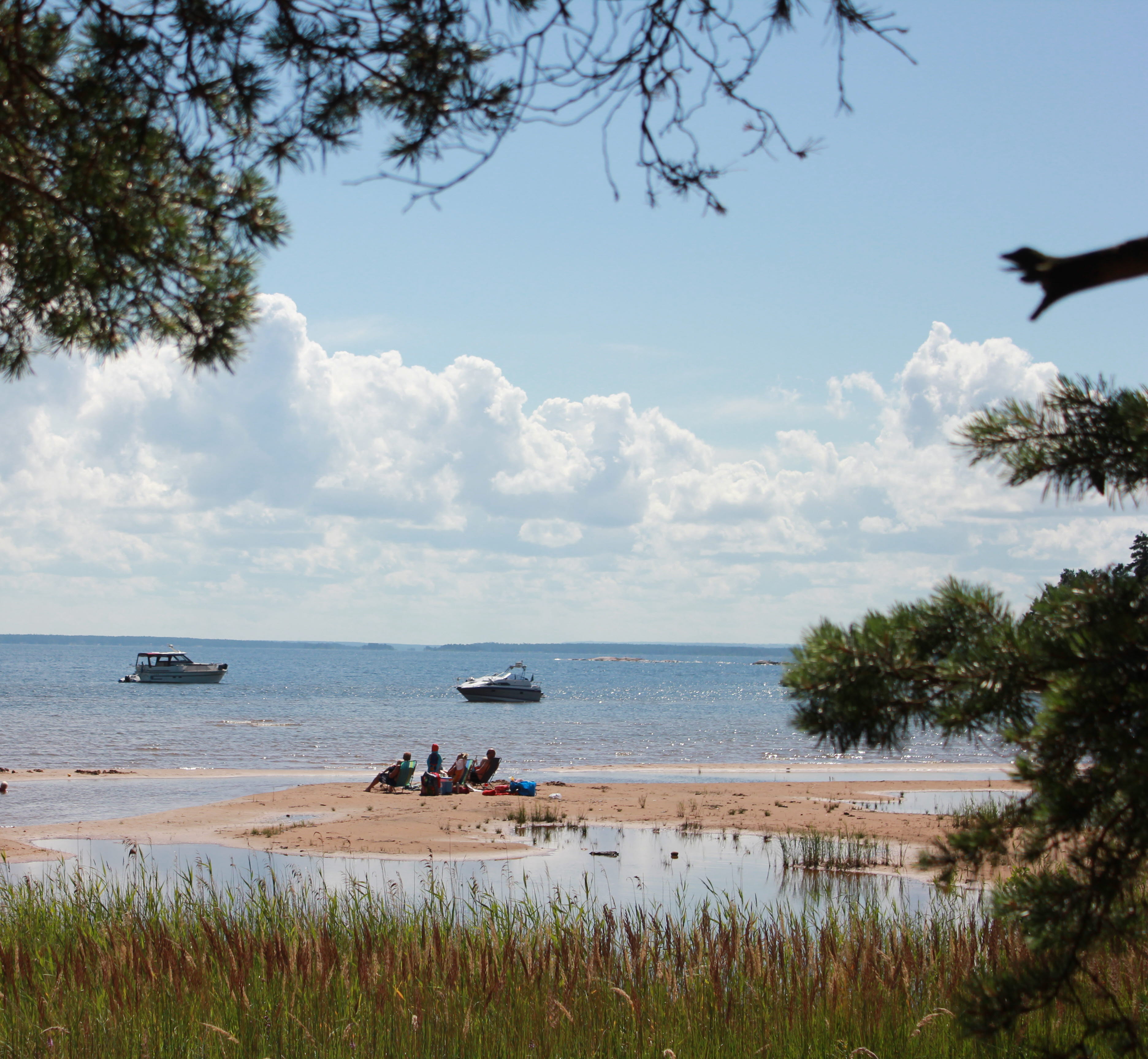 People who sunbathe and swim on the sand dunes at Hovden on Brömmö in the Vänern archipelago.