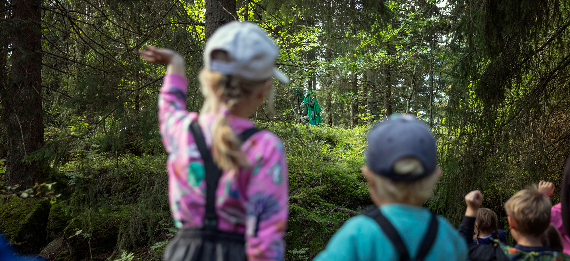 Two kids playing in the forrest