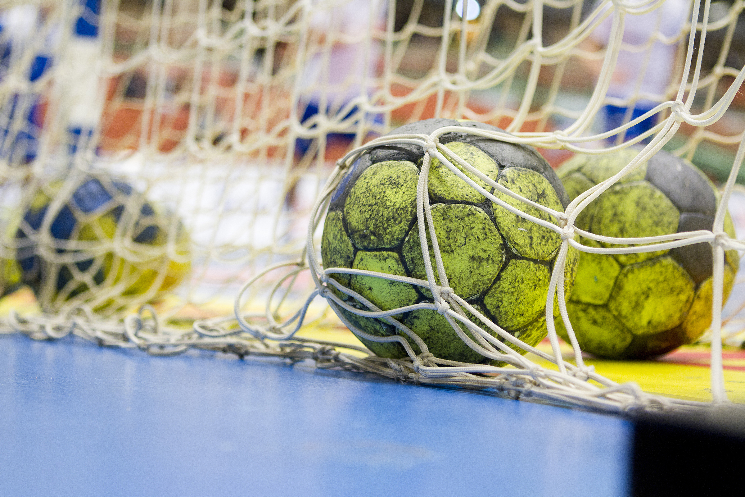 Three handballs in a net.