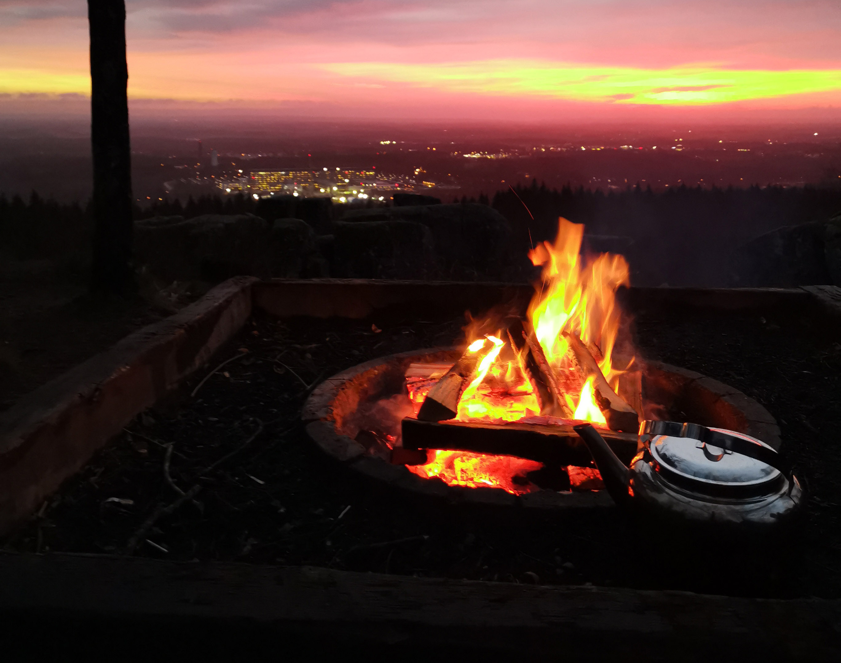 A bursting fire in front of an equally fiery and magnificent sunrise.