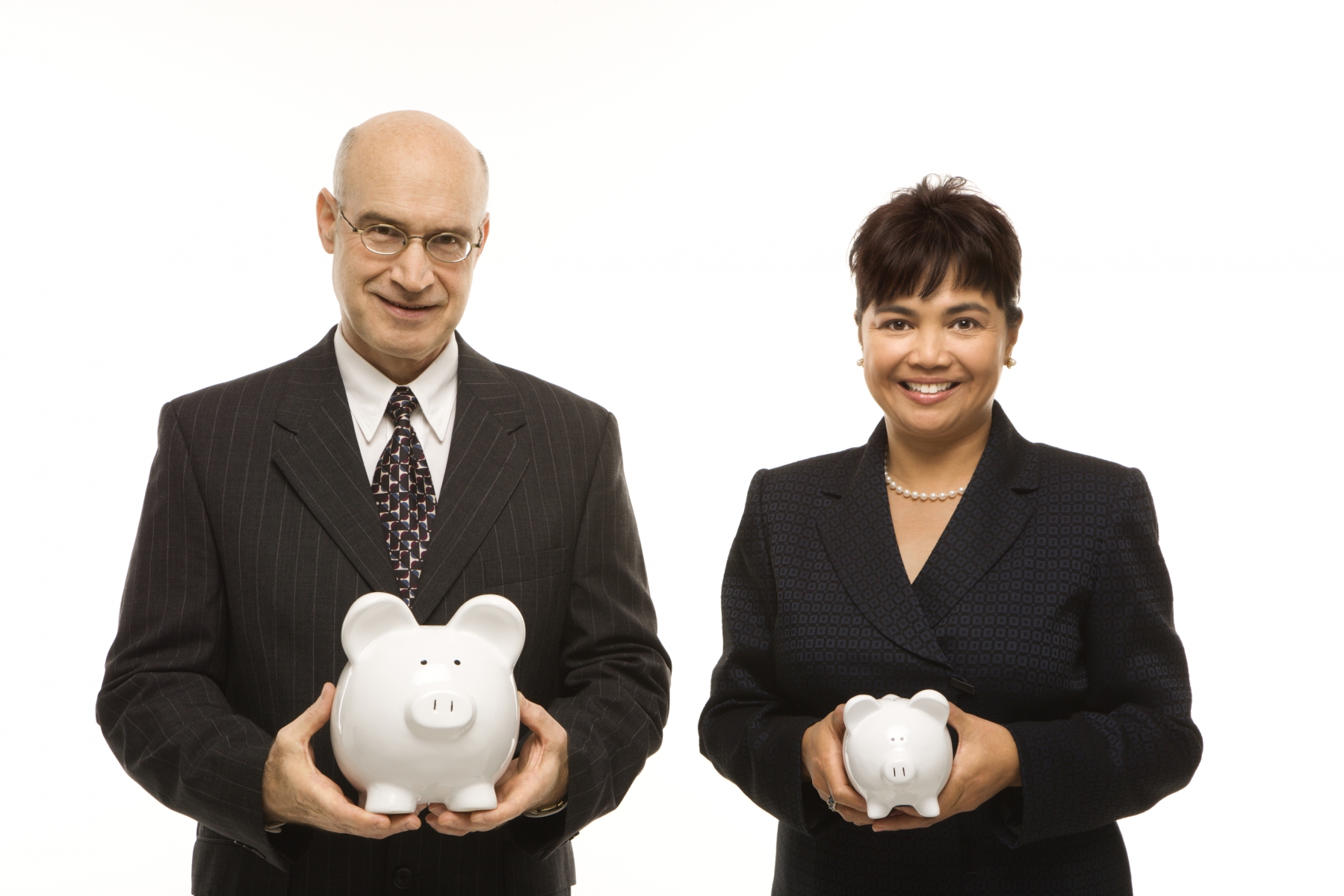 A man holding a large white piggy bank and a woman holding a smaller white piggy bank.