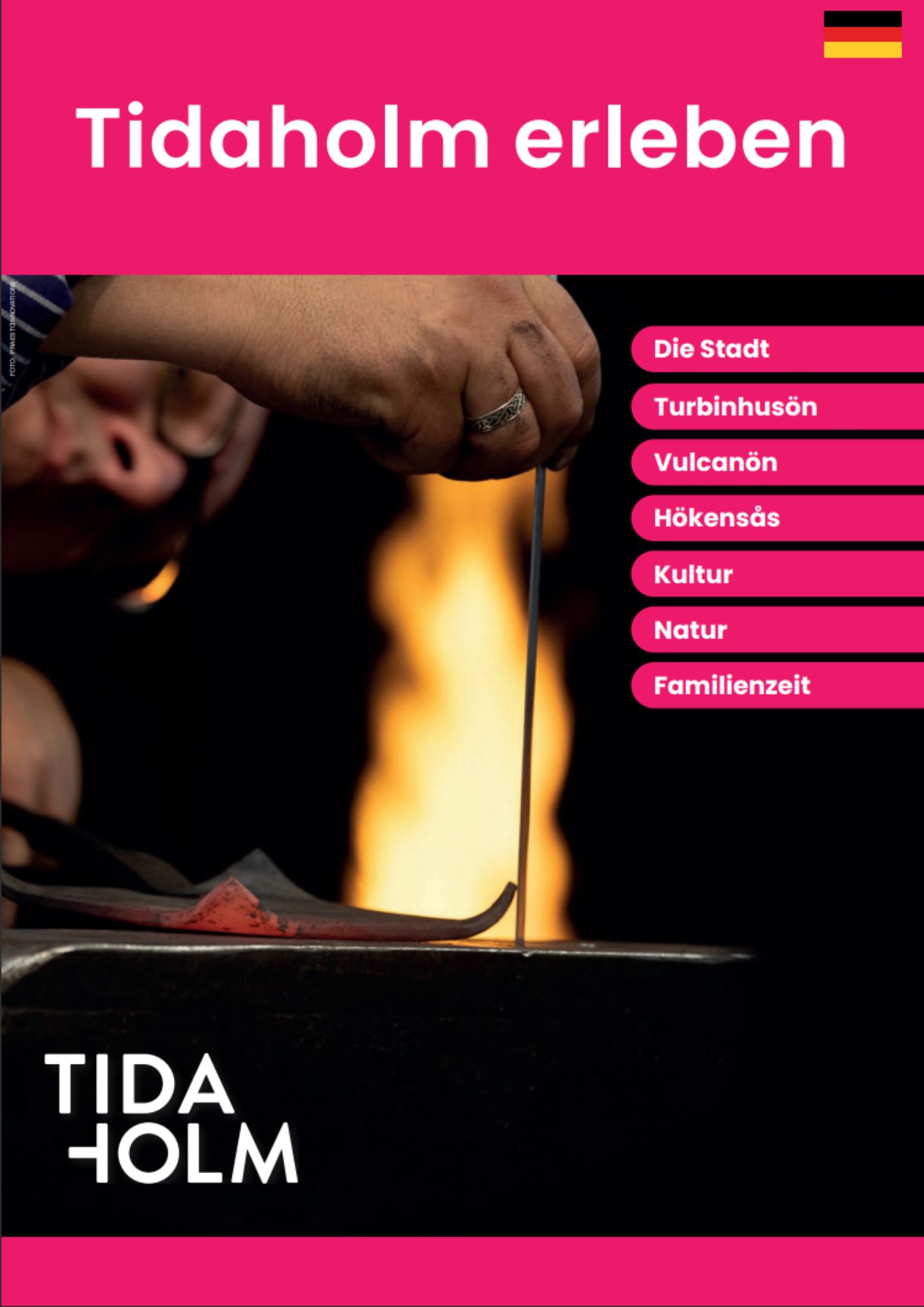 A man stands and forges an object with a flame in the background
