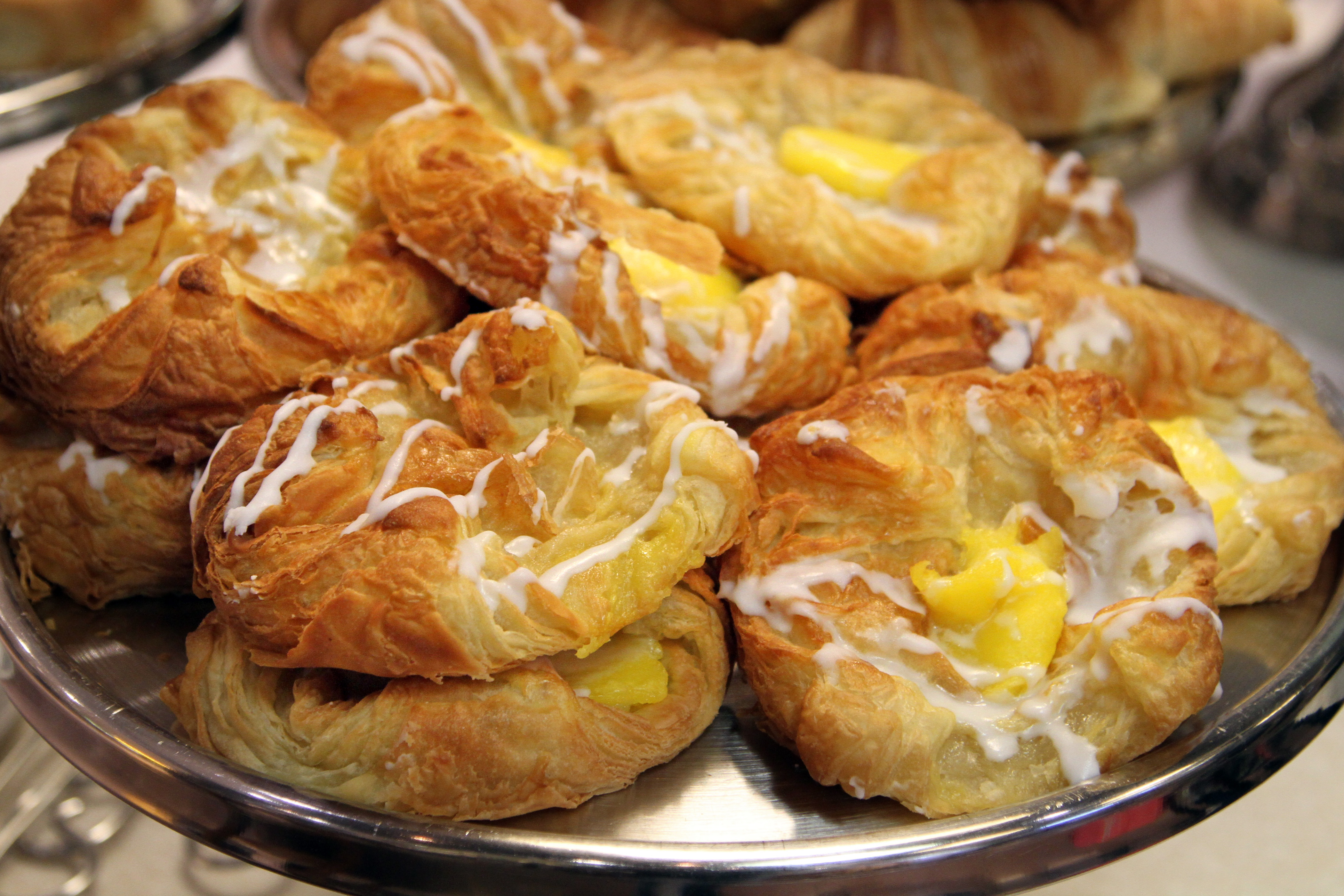 Several pastries on a barrel.