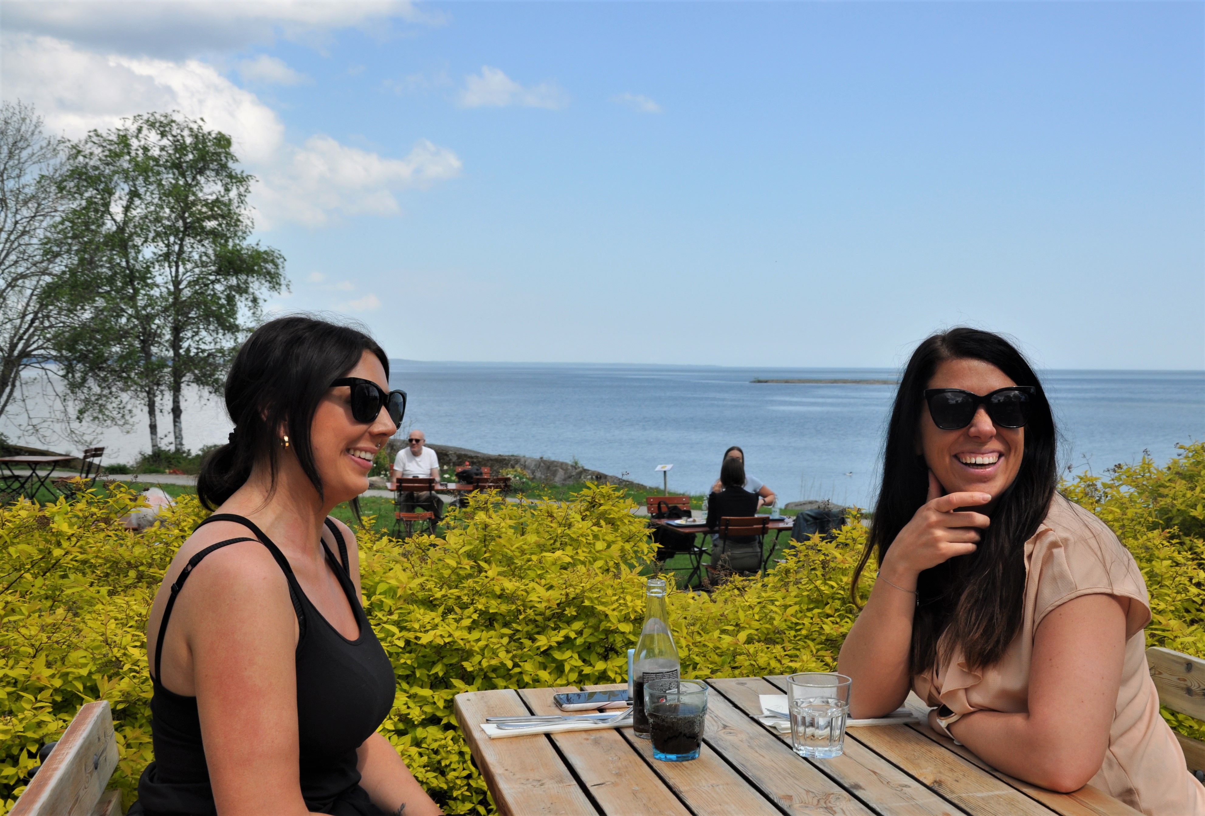 two girls smiling at table