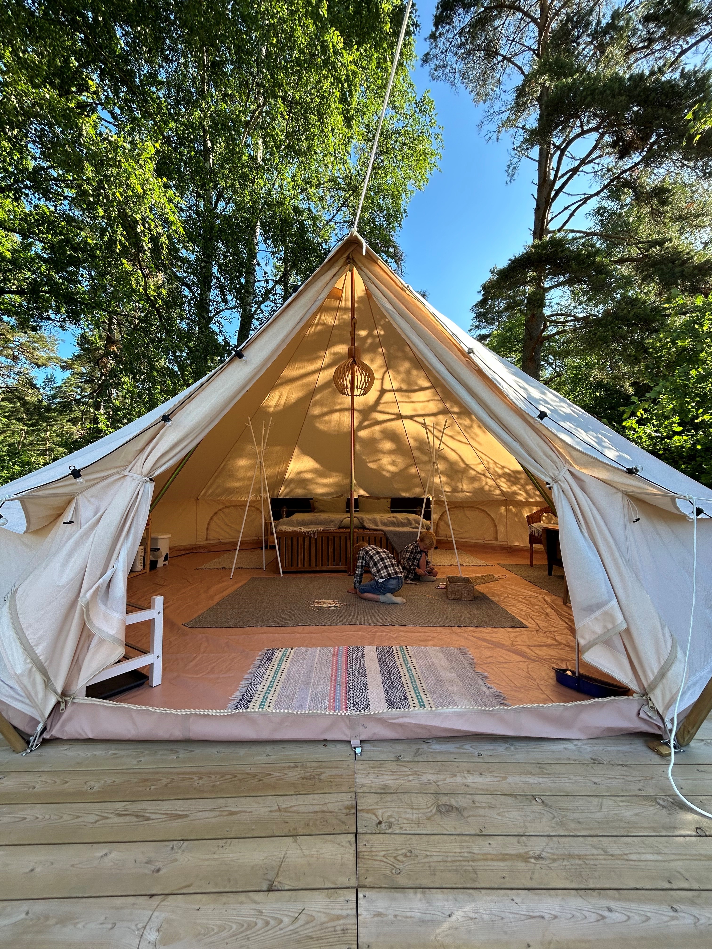 Open glamping tent with furnitures