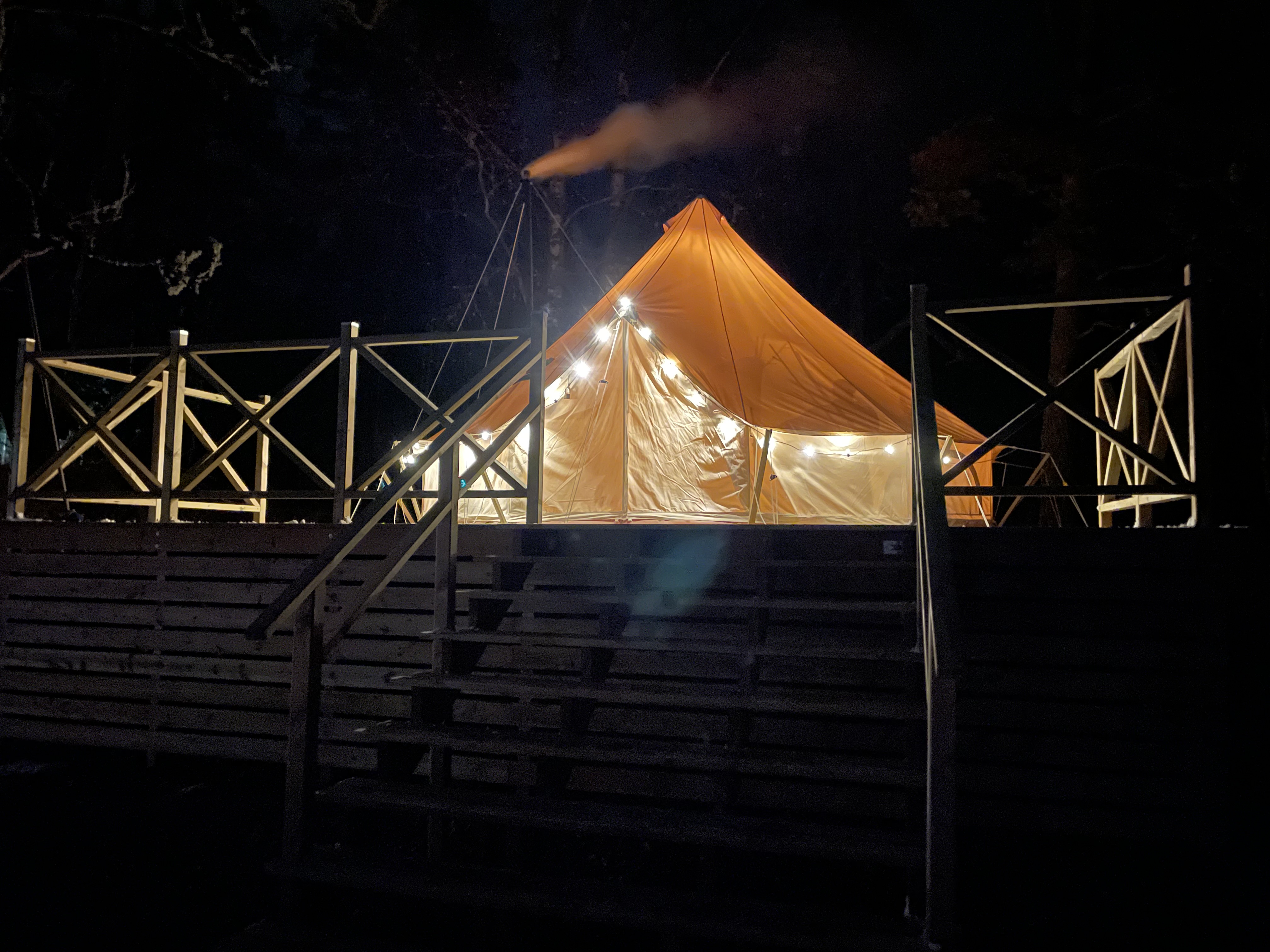 A glamping tent during the night 