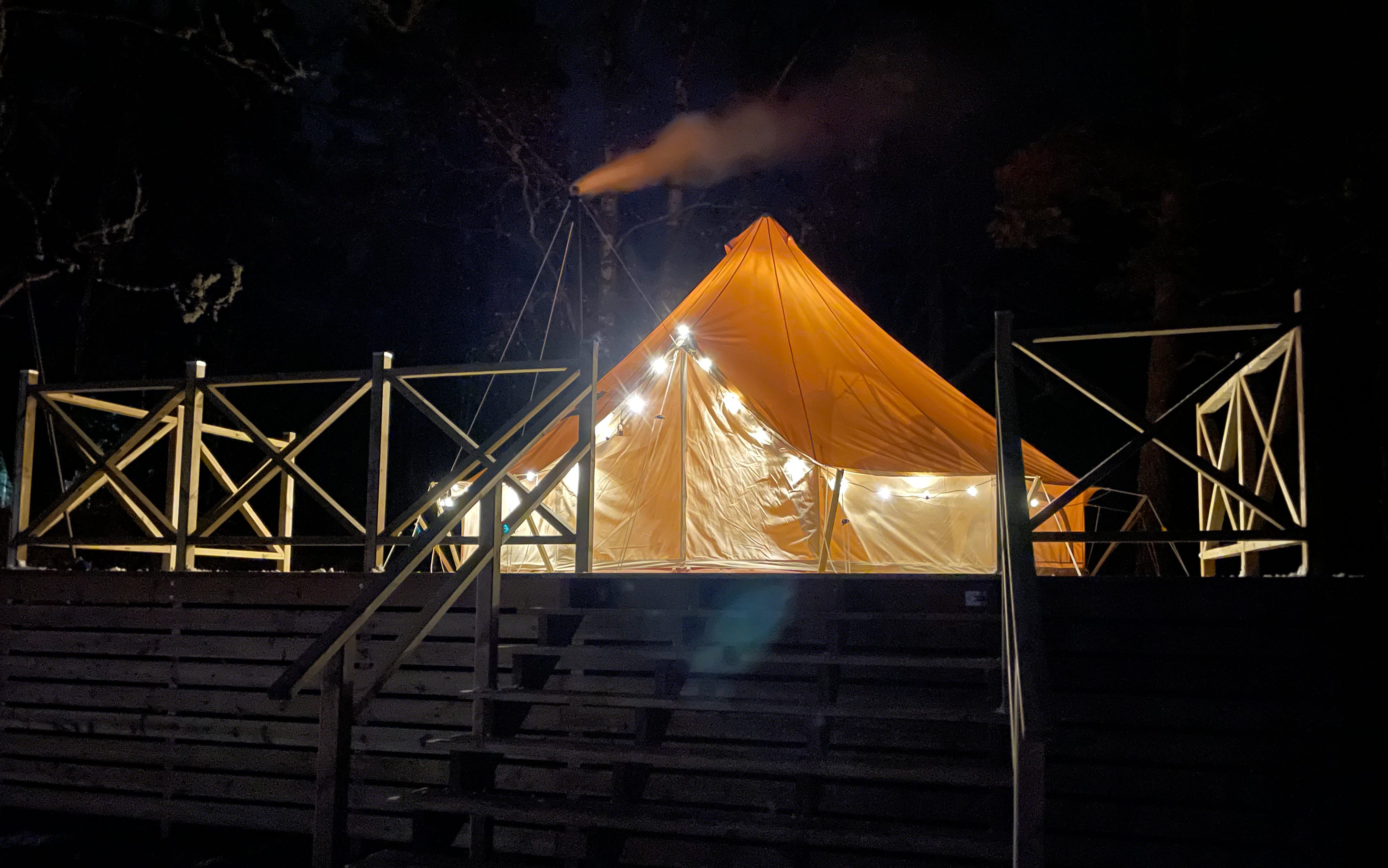 A glamping tent during the night 