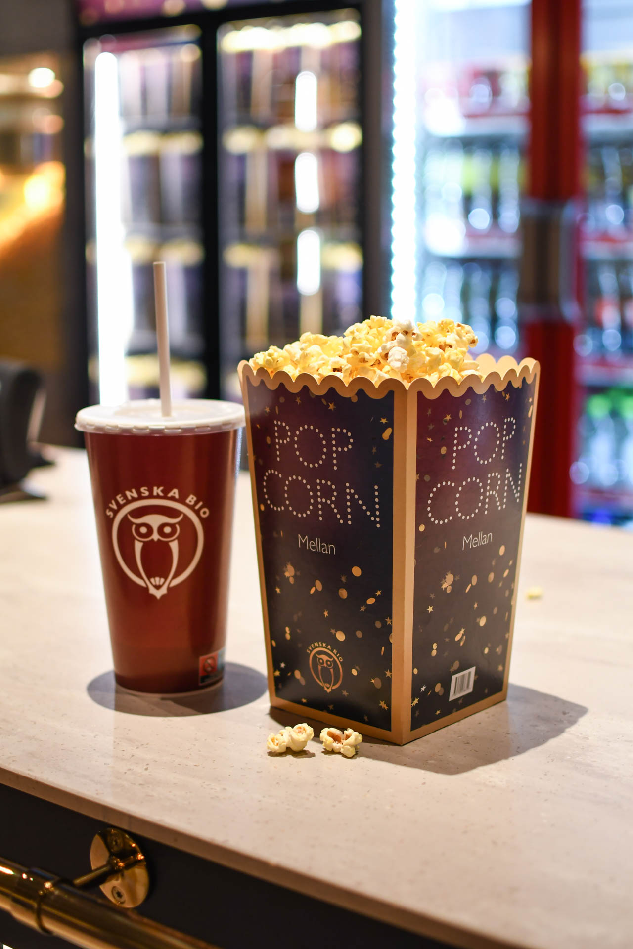 Popcorn and soda on a desk