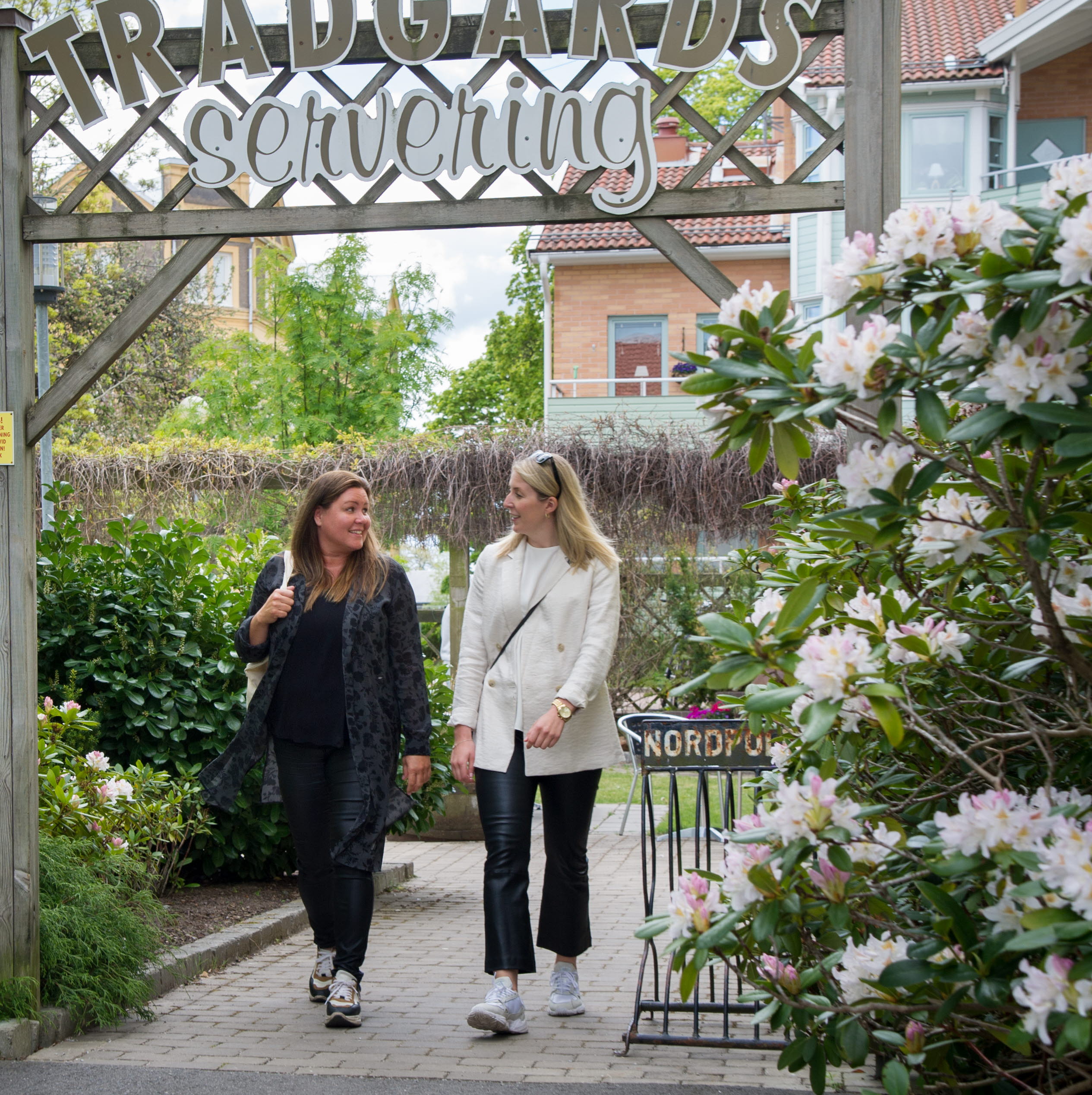 Two people walking outside